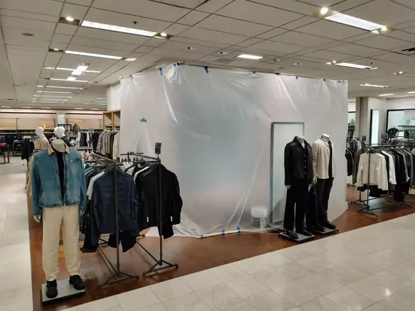 Retail store interior sealed off for after-hours painting