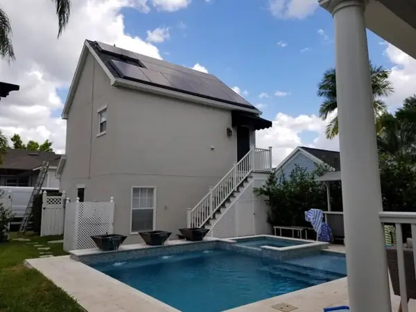 Carriage house by the pool after an exterior repaint