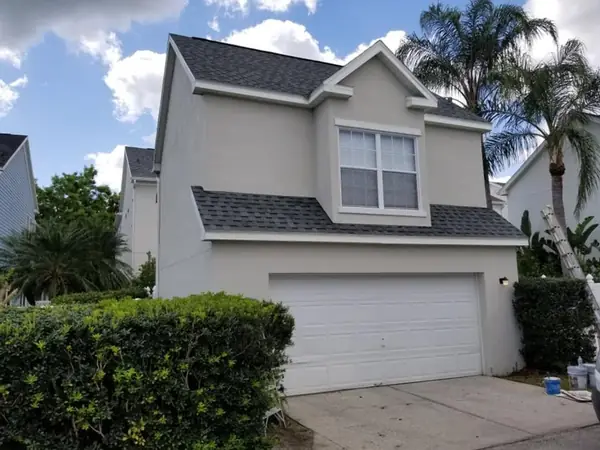 Stucco home and garage after a repaint