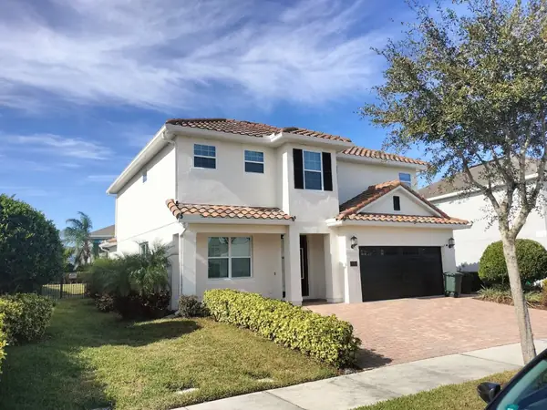 Two-story stucco home after an exterior repaint
