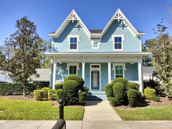 Blue Victorian home in Celebration, FL after an exterior repaint by Ferguson's