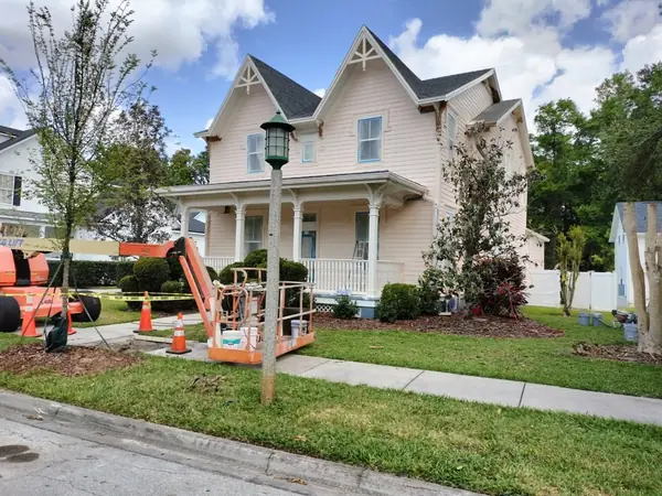 Pink Victorian home during the exterior repaint