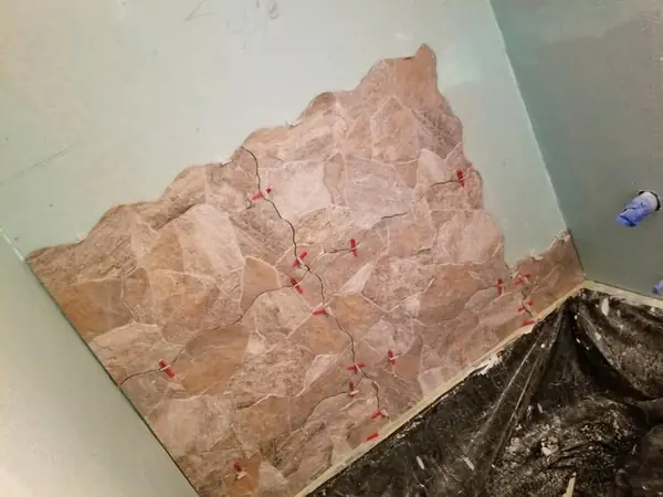 Stone-look tile shower going in