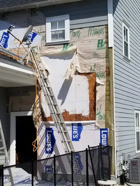 New sheathing and house wrap before siding